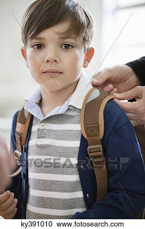 Stock Image - Portrait of a schoolboy with schoolbag. Fotosearch