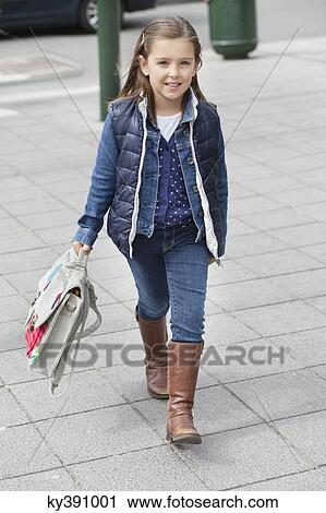 Portrait of a schoolgirl carrying schoolbag View Large Photo Image Stock Image - Portrait of a schoolgirl carrying schoolbag. Fotosearch