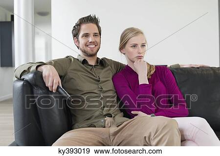 Stock Photo - Couple watching television. Fotosearch