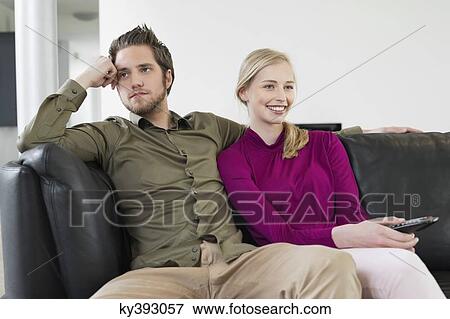 Couple watching television View Large Photo Image Stock Photo - Couple watching television. Fotosearch