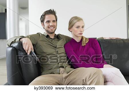 Couple watching television View Large Photo Image Stock Photo - Couple watching television. Fotosearch