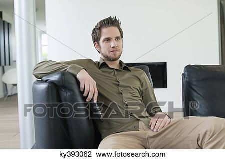 Man watching television View Large Photo Image Stock Image - Man watching television. Fotosearch