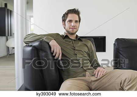 Man watching television View Large Photo Image Stock Photo - Man watching television. Fotosearch