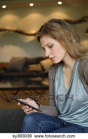 Woman using digital tablet View Large Photo Image Stock Photo - Woman using digital tablet. Fotosearch