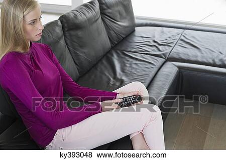 Stock Photo - Woman watching television. Fotosearch