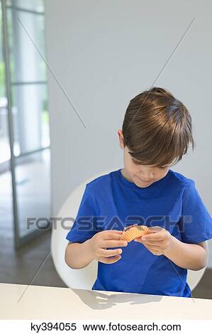 Boy holding a cup cake View Large Photo Image Stock Photography - Boy holding a cup cake. Fotosearch