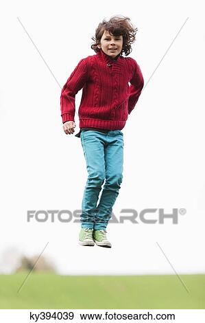 Boy jumping View Large Photo Image Stock Photo - Boy jumping. Fotosearch