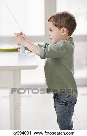 Boy playing with toys View Large Photo Image Stock Image - Boy playing with toys. Fotosearch