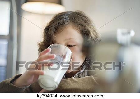 Close-up of a boy drinking a glass of milk View Large Photo Image Picture - Close-up of a boy drinking a glass of milk. Fotosearch