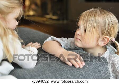 Close-up of two cute girls playing at home View Large Photo Image Stock Image - Close-up of two cute girls playing at home. Fotosearch