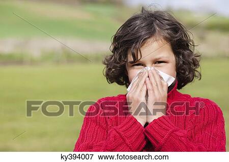 Portrait of a boy blowing his nose View Large Photo Image Stock Photo - Portrait of a boy blowing his nose. Fotosearch