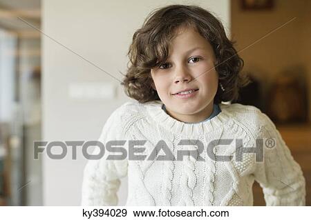 Portrait of a boy smiling at home View Large Photo Image Stock Photo - Portrait of a boy smiling at home. Fotosearch