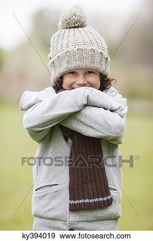 Stock Photo - Portrait of a boy smiling in a field. Fotosearch