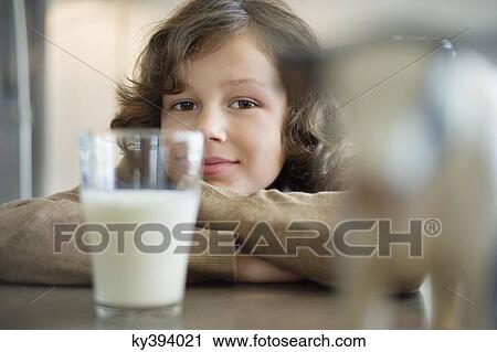 Portrait of a boy with a glass of milk View Large Photo Image Stock Image - Portrait of a boy with a glass of milk. Fotosearch
