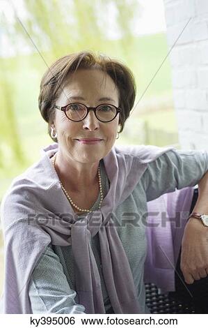 Stock Photograph - Portrait of a happy elderly woman. Fotosearch