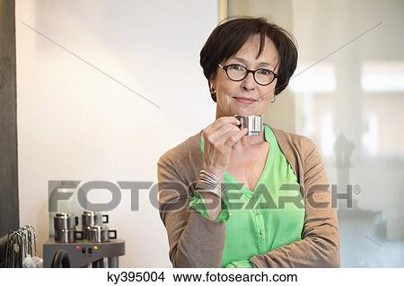 Portrait of a woman drinking coffee View Large Photo Image Picture - Portrait of a woman drinking coffee. Fotosearch