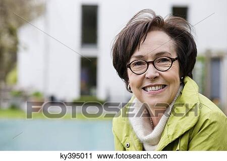 Portrait of a woman smiling View Large Photo Image Stock Image - Portrait of a woman smiling. Fotosearch
