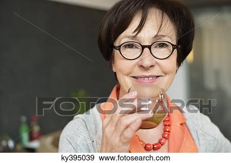 Woman drinking tea View Large Photo Image Stock Photo - Woman drinking tea. Fotosearch