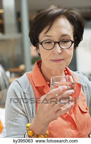 Woman drinking water View Large Photo Image Stock Image - Woman drinking water. Fotosearch