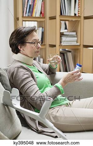 Woman reading a prescription View Large Photo Image Stock Photo - Woman reading a prescription. Fotosearch