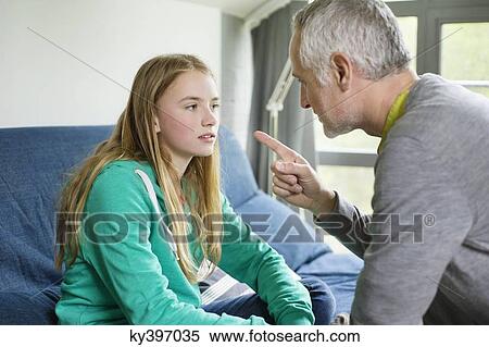 Man scolding his daughter at home View Large Photo Image Stock Photography - Man scolding his daughter at home. Fotosearch