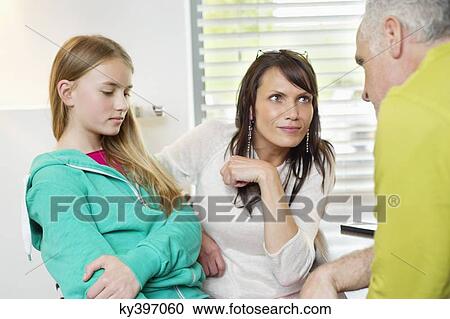 Parents scolding daughter at home View Large Photo Image Stock Image - Parents scolding daughter at home. Fotosearch