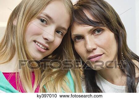 Portrait of mother and daughter smiling View Large Photo Image Stock Image - Portrait of mother and daughter smiling. Fotosearch