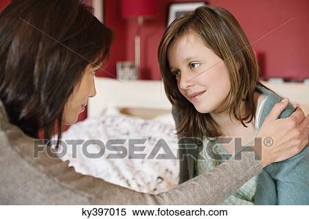 Stock Photography - Woman consoling her daughter. Fotosearch