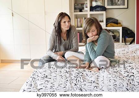 Woman scolding her daughter in the bedroom View Large Photo Image Stock Photography - Woman scolding her daughter in the bedroom. Fotosearch