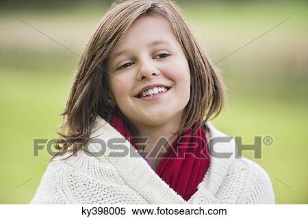 Girl smiling in a park View Large Photo Image Stock Photography - Girl smiling in a park. Fotosearch