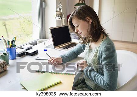 Girl studying at home View Large Photo Image Stock Photography - Girl studying at home. Fotosearch