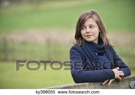 Girl thinking in a farm View Large Photo Image Stock Photography - Girl thinking in a farm. Fotosearch