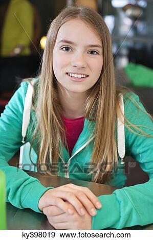 Stock Photo - Portrait of a girl smiling. Fotosearch
