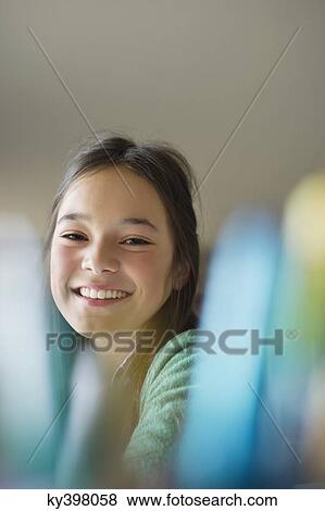 Portrait of a happy girl smiling View Large Photo Image Stock Photo - Portrait of a happy girl smiling. Fotosearch