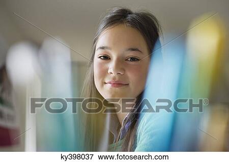 Stock Photo - Portrait of a happy girl. Fotosearch