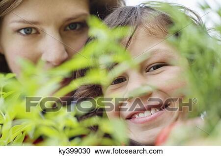 Portrait of a boy with his mother smiling View Large Photo Image Stock Image - Portrait of a boy with his mother smiling. Fotosearch