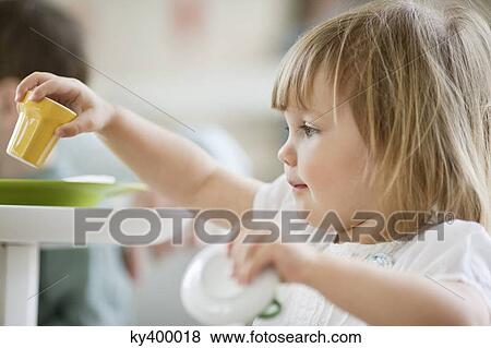 Close-up of a girl playing with toys View Large Photo Image Stock Photo - Close-up of a girl playing with toys. Fotosearch