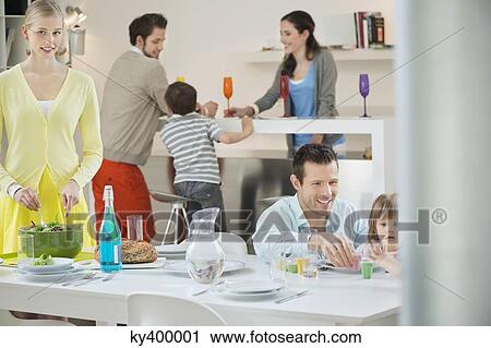 Family setting table for dinner View Large Photo Image Stock Image - Family setting table for dinner. Fotosearch