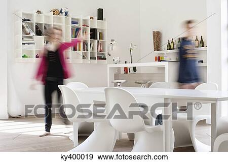 Man and woman standing beside a dining table at home View Large Photo Image Stock Photo - Man and woman standing beside a dining table at home. Fotosearch