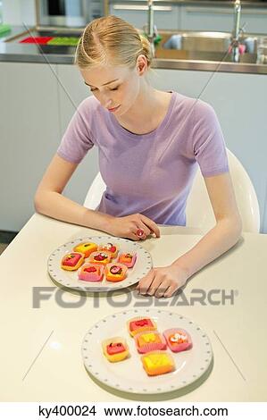 Woman with cup cakes View Large Photo Image Picture - Woman with cup cakes. Fotosearch