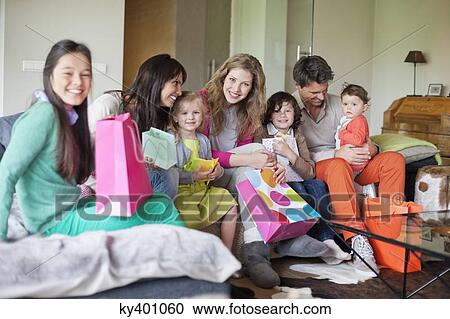 Stock Image - Family at a birthday party. Fotosearch