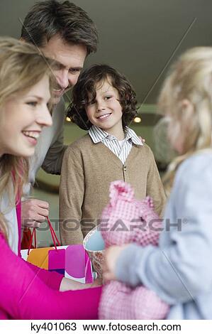 Stock Image - Happy family at home. Fotosearch