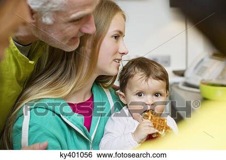 Happy family at home View Large Photo Image Stock Photograph - Happy family at home. Fotosearch