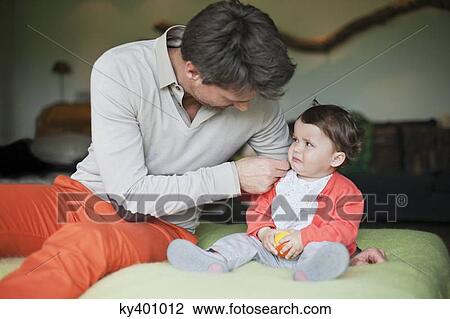 Man consoling his crying daughter View Large Photo Image Stock Image - Man consoling his crying daughter. Fotosearch