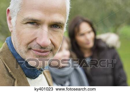 Stock Image - Portrait of a man with his family. Fotosearch