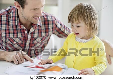 Man teaching his daughter View Large Photo Image Stock Image - Man teaching his daughter. Fotosearch