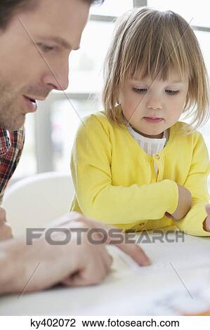 Stock Image - Man teaching his daughter. Fotosearch