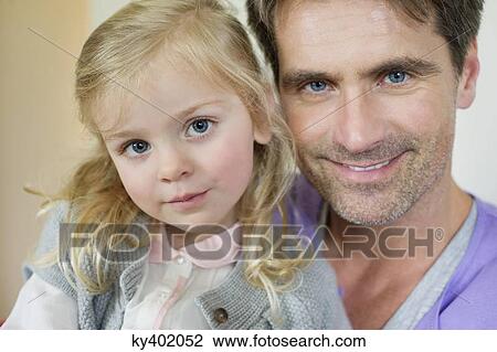 Portrait of a happy man with his daughter View Large Photo Image Stock Image - Portrait of a happy man with his daughter. Fotosearch