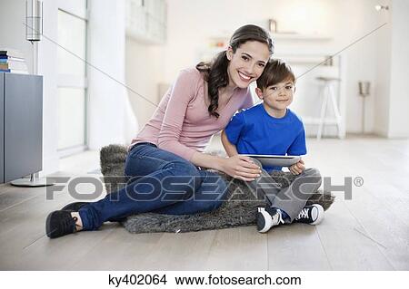 Picture - Portrait of a woman sitting with her son. Fotosearch