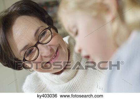 Stock Photograph - Close-up of a girl with her grandmother. Fotosearch